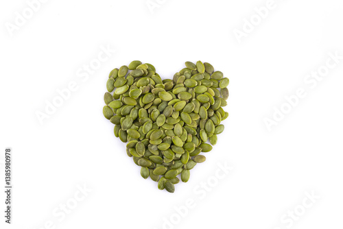 Delicious pumpkin seeds on white background