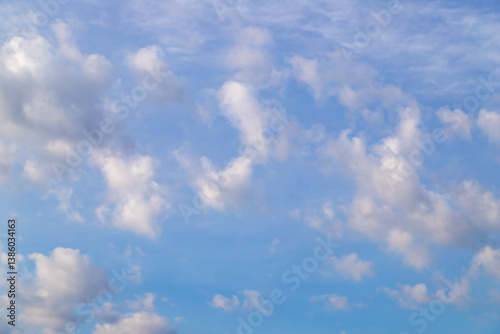 Blue Sky with Scattered Fluffy White Clouds on a Clear Day
