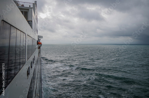 Obraz na płótnie Views onto wet outdoor teak balcony terrace veranda promenade boat deck of ocean liner cruiseship cruise ship with chairs and loungers at sea during w salonie