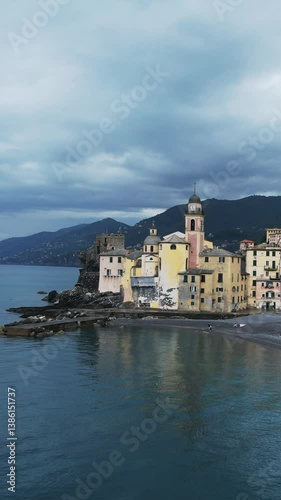 Wallpaper Mural Colorful waterfront buildings line the quaint seaside town of Camogli in Genoa, Italy. Captured in an aerial view, the stunning Basilica di Santa Maria Assunta near a small harbor Torontodigital.ca