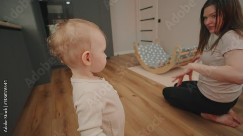 Mother interacts with toddler in a cozy indoor play area during daytime in a family home