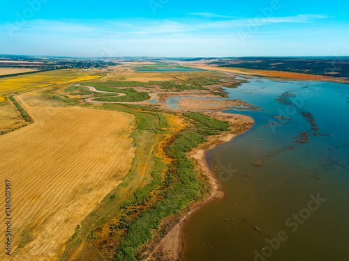 Wallpaper Mural This aerial view showcases a vibrant landscape of vast farmland and a winding river flowing gracefully through Torontodigital.ca
