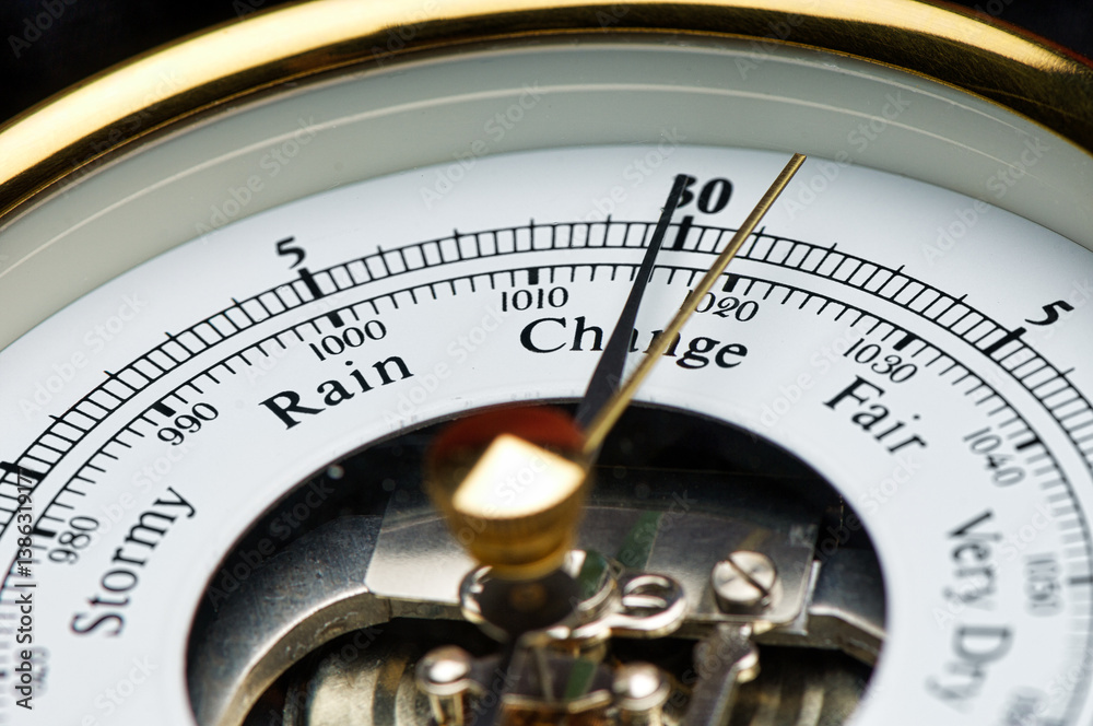 Close-up of old fashioned barometer pointing to Change Close-up of old fashioned barometer pointing to Change