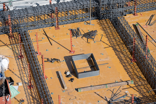 Photography Construction workers preparing reinforced concrete beam and slab formwork at bui