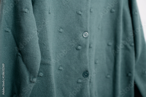Wallpaper Mural Detailed view of a green textured fabric with buttons, suitable for fashion, sewing, or clothing design concepts. Torontodigital.ca