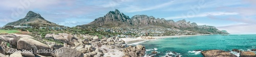 Cape Town, South Africa with Table mountain, Camps Bay and the 12 Apostles - Breathtaking travel panorama with misty sky