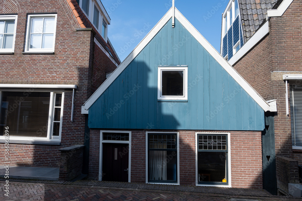 Tourists destination in North Holland, old authentic fishermen village Volendam near Amsterdam with old houses and narrow streets Tourists destination in North Holland, old authentic fishermen village Volendam near Amsterdam with old houses and narrow streets