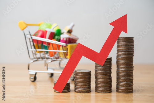 Red arrow growth chart and stack coins with food, drinks, vegetables, fruits in supermarket trolley. Rising cost of living, food price increase, inflation crisis, war effect to global economic concept