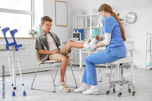 Injured little boy with ban...