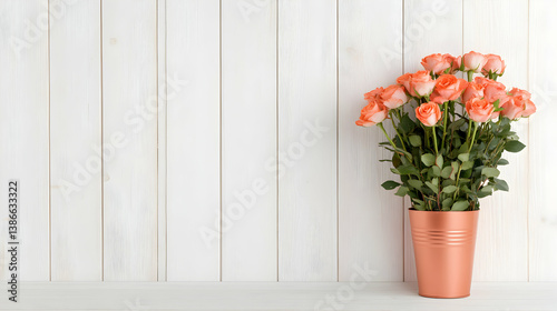 Coral Roses in Copper Pot Against White Wooden Background