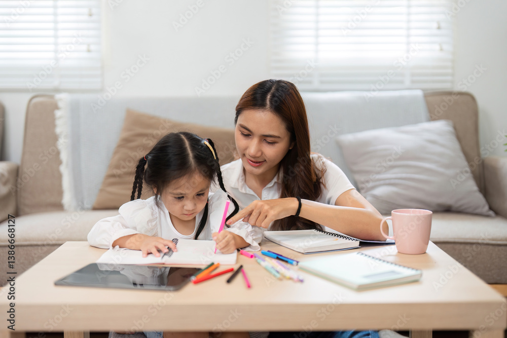 Back to School and Learning Activities. A mother engages with her daughter in a fun educational session at home, encouraging creative learning. Back to School and Learning Activities. A mother engages with her daughter in a fun educational session at home, encouraging creative learning.