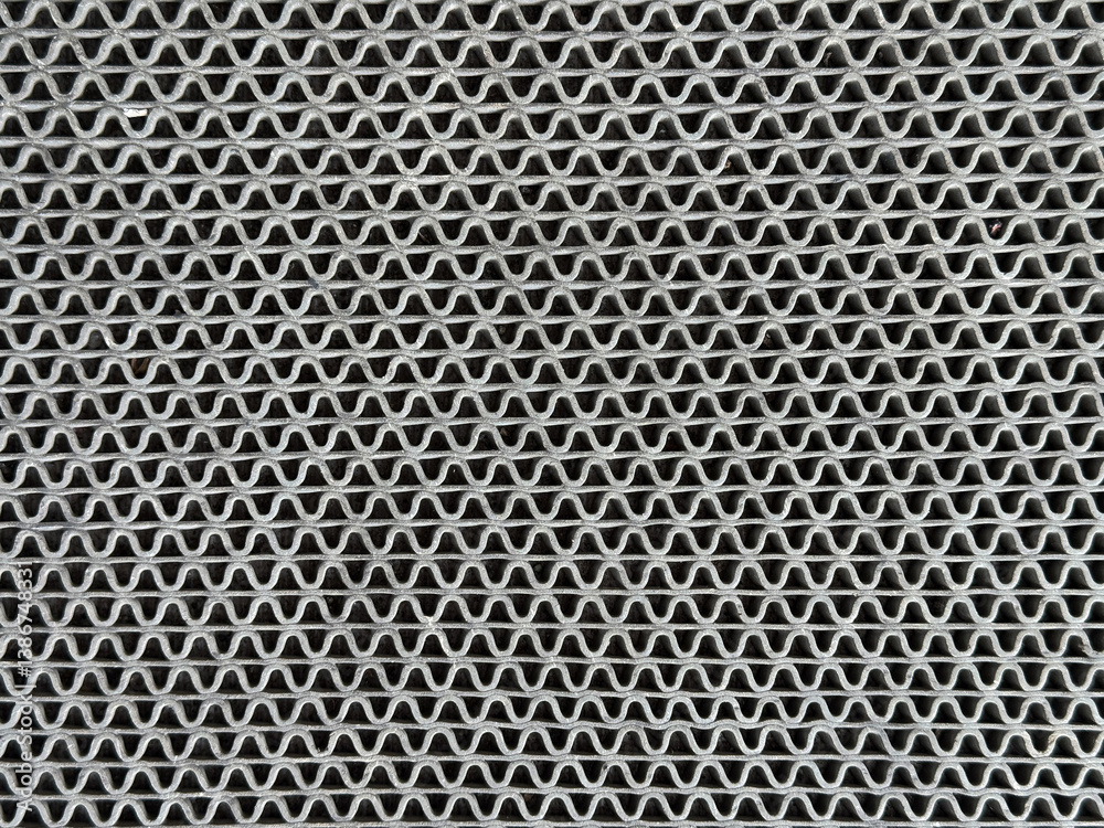 Close up of molded rattan lattice in random weaving texture. Grey rattan art in curvy weaving pattern. Seamless background texture Close up of molded rattan lattice in random weaving texture. Grey rattan art in curvy weaving pattern. Seamless background texture