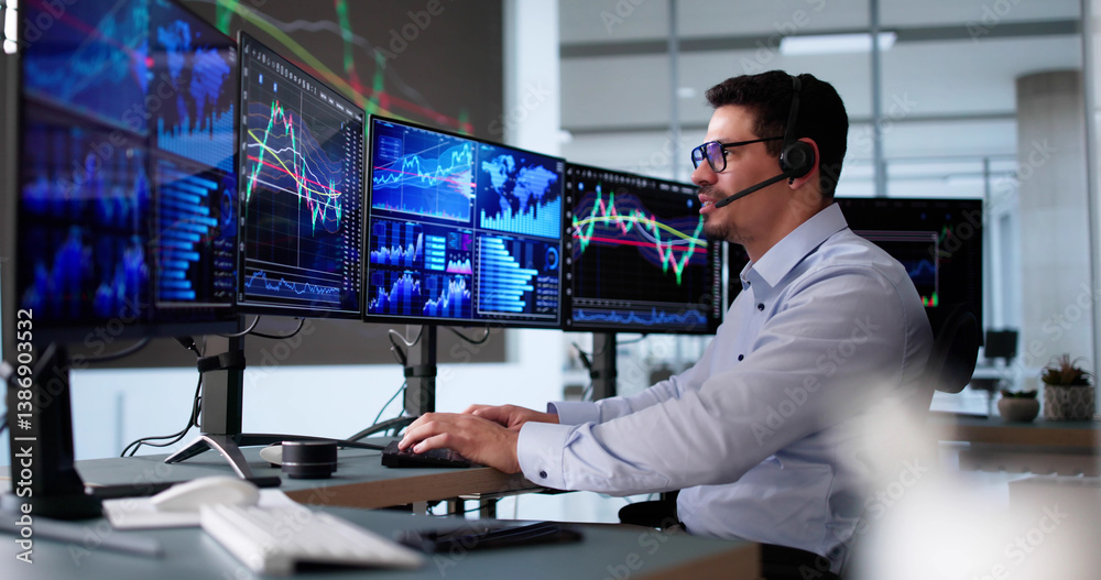 Hispanic Man Looking At Multiple Screens