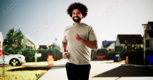 Obraz na płótnie African athlete sprints confidently through city streets during morning w salonie