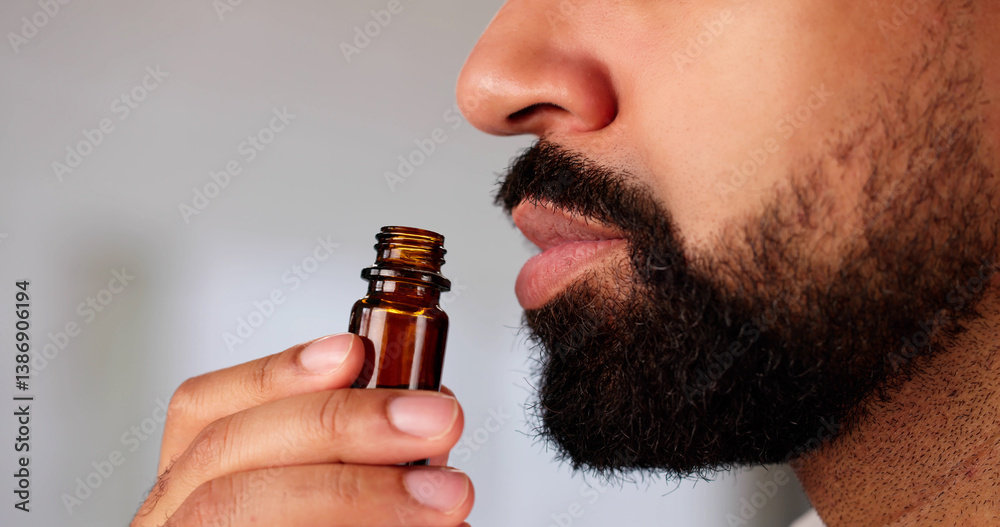 Herbal Aromatherapy: Young Black Man Inhaling Essential Oil
