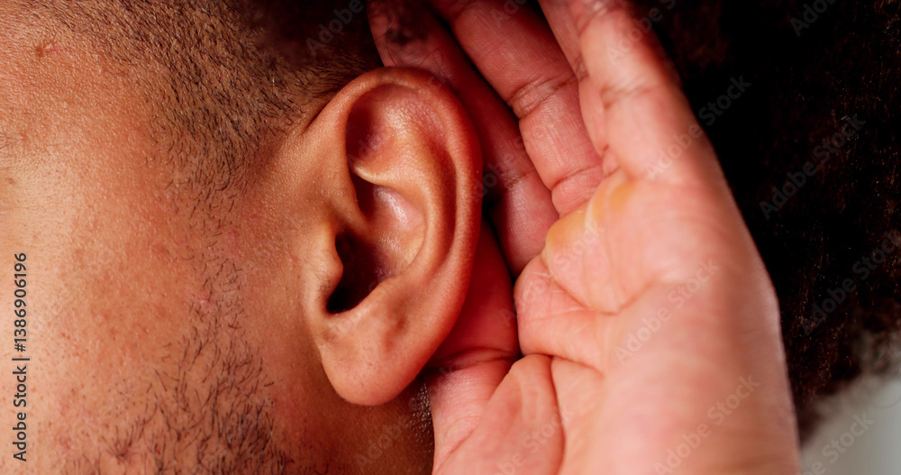Audiologist treating African man with painful