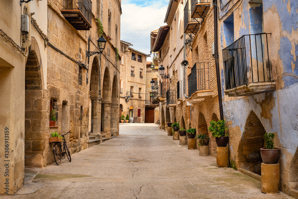 Fototapeta premium Picturesque streets with plants and arches in the medieval houses of the town of La Fresneda, Matarrana.