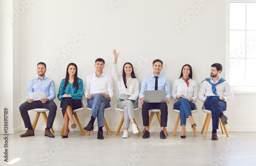 Obraz na płótnie Diverse job seekers waiting for interview, female applicant hand raising sitting in queue, finding new company recruit among candidates vacancy waiting, human resources, hiring and job search, seminar w salonie