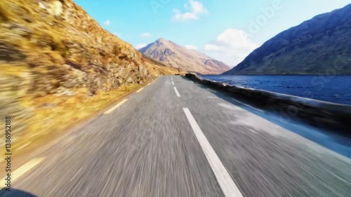 Driving on scenic road with mountains and lakes, wild Atlantic way hyper lapse,  Delphi, county Mayo, Ireland photo
