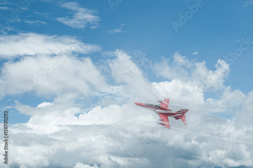 Fighter jet flies through the sky on technology background