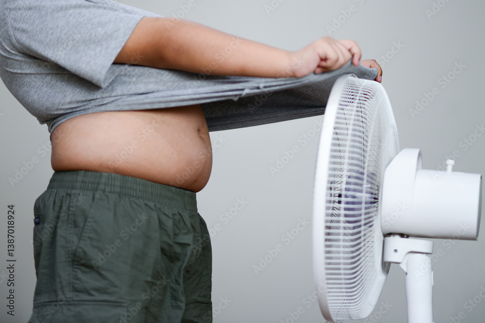 Fan hot weather and children Hot child standing in front of a fan fat child