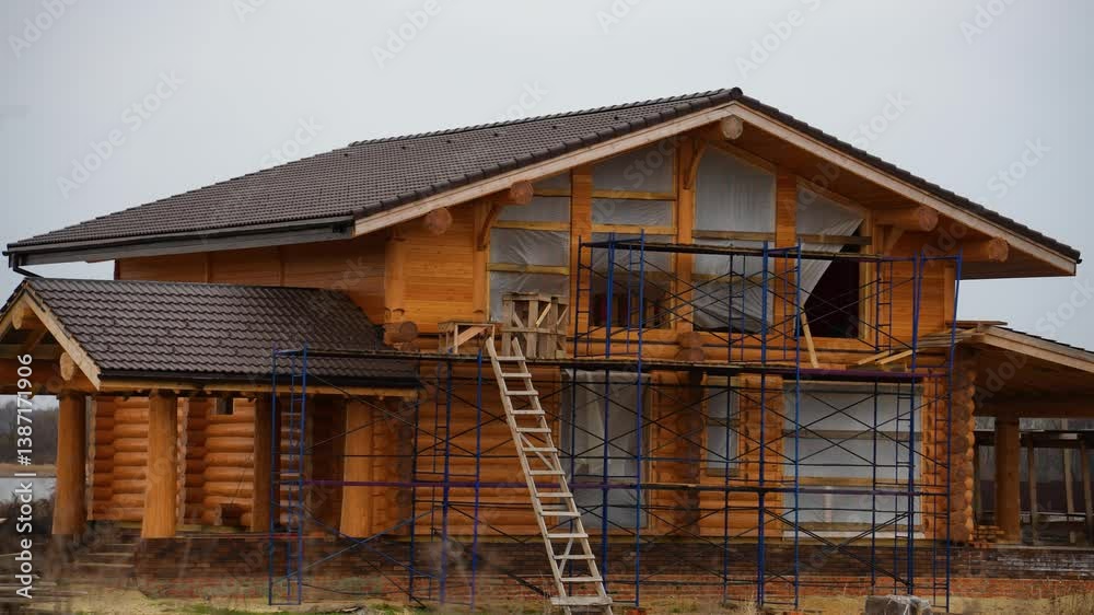 construction of a large wooden house made of timber construction of a large wooden house made of timber