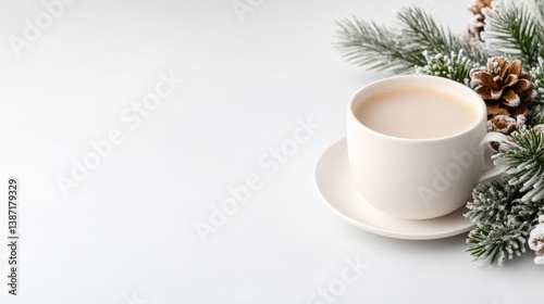 Wallpaper Mural A white mug filled with a creamy beverage sits on a saucer. Pine branches with pinecones decorate the right side of the image. The background is a simple white surface. The image is bright, clean, an Torontodigital.ca