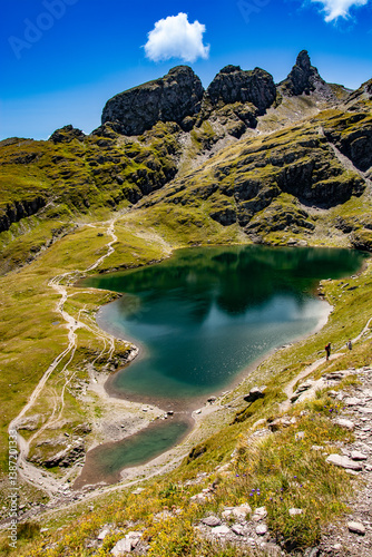 Schwarzsee on the Pizol,  canton of St. Gallen at an altitude of 2372m photographed on the 5 lakes hike. The turquoise colour and the impressive mountains reflected in the lake are simply breathtaking