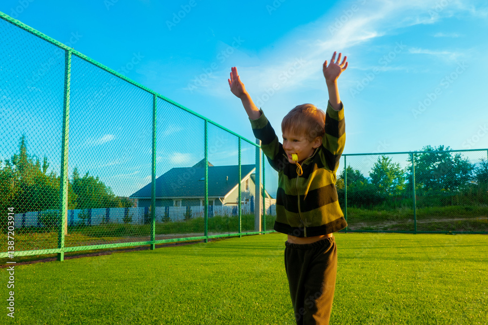 The child goes in for sports at the stadium. The boy training before playing football. High quality photo