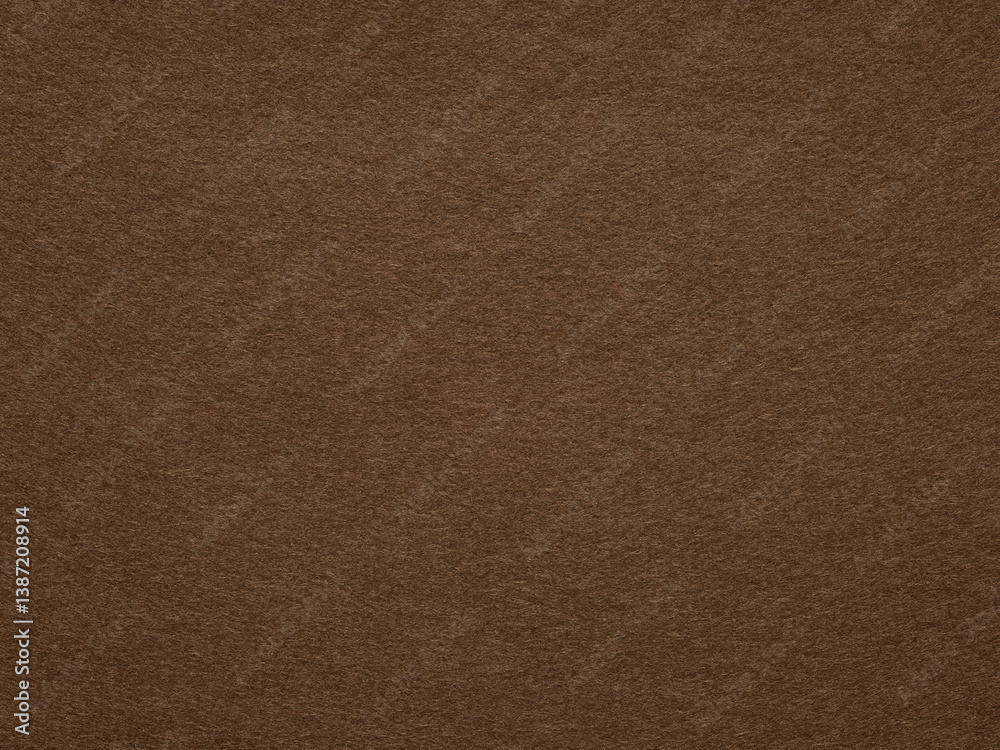 A warm and inviting brown felt texture exudes a cozy, velvety softness, reminiscent of autumnal comfort and rustic elegance