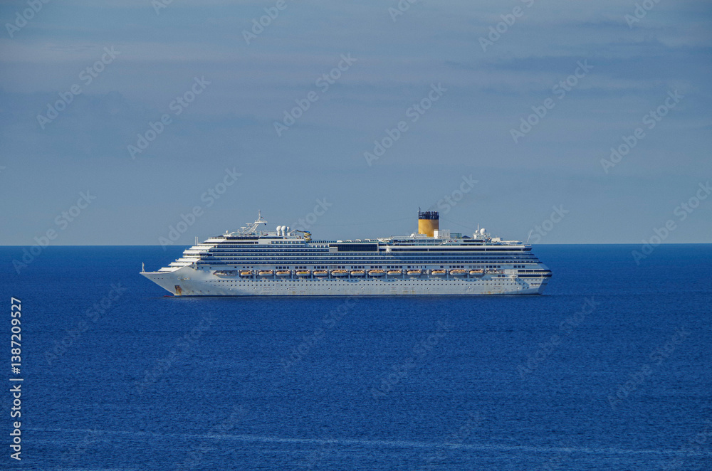 Mega family cruiseship cruise ship liner Pacifica anchored offshore of Civitavecchia Rome, Italy before reactived after Covid pandemic with other vessels in port and coastline