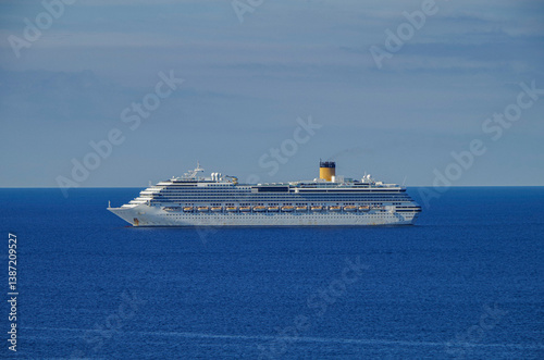 Obraz na płótnie Mega family cruiseship cruise ship liner Pacifica anchored offshore of Civitavecchia Rome, Italy before reactived after Covid pandemic with other vessels in port and coastline w salonie