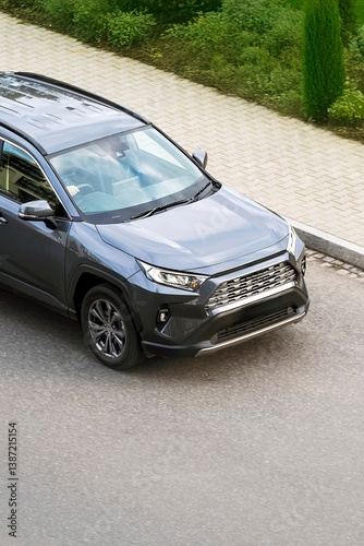 Urban vehicle driving near pavement