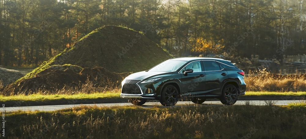 Sleek car in motion during golden hour