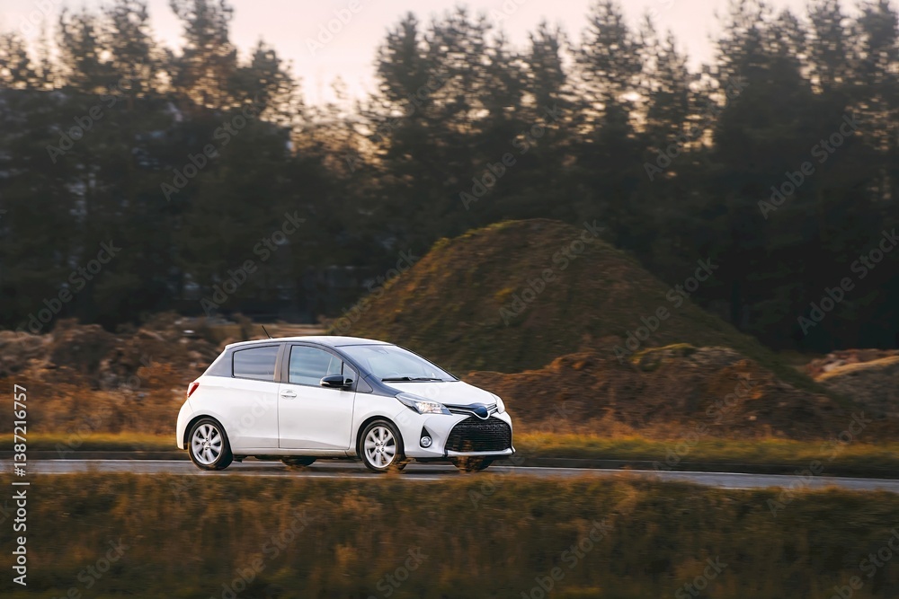 Hatchback vehicle in motion on highway