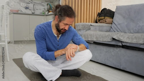 Bearded Man Checking Fitness Activity On The Smart Watch After Before Yoga Train