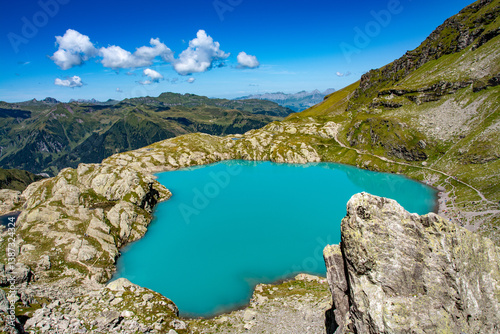 Schottensee on the Pizol, St. Gallen at an altitude of 2332m photographed on the 5 lakes hike. The turquoise colour and the impressive mountains reflected in the lake are simply breathtaking.
