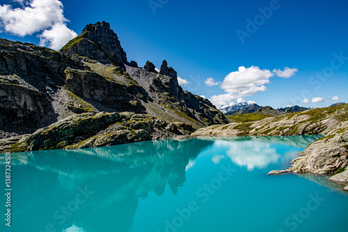 Schottensee on the Pizol, St. Gallen at an altitude of 2332m photographed on the 5 lakes hike. The turquoise colour and the impressive mountains reflected in the lake are simply breathtaking.