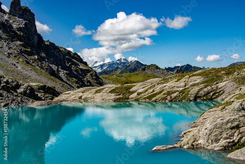 Schottensee on the Pizol, St. Gallen at an altitude of 2332m photographed on the 5 lakes hike. The turquoise colour and the impressive mountains reflected in the lake are simply breathtaking.