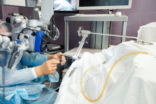 Process of surgery operation using laparoscopic equipment and laser. Group of surgeons in operating room with surgery equipment.New technologies concept.