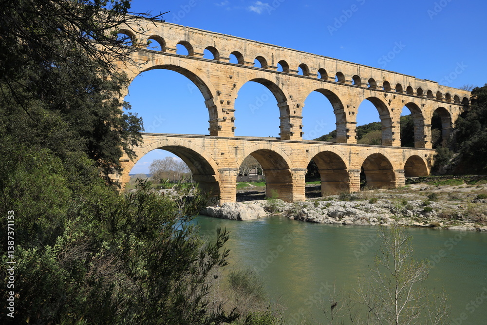 Fototapeta premium Pont du Gard, an ancient Roman aqueduct bridge crossing the Gardon river in Gard department, southern France