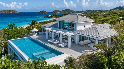 Exclusive coastal home featuring luxury pool overlooking pristine beach waters