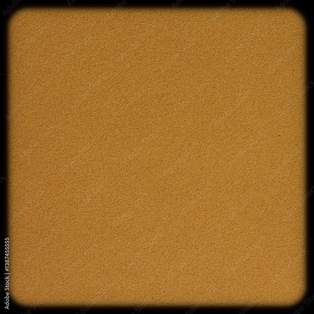 close up of blank brown flat sponge tile with rounded corners against black close up of blank brown flat sponge tile with rounded corners against black