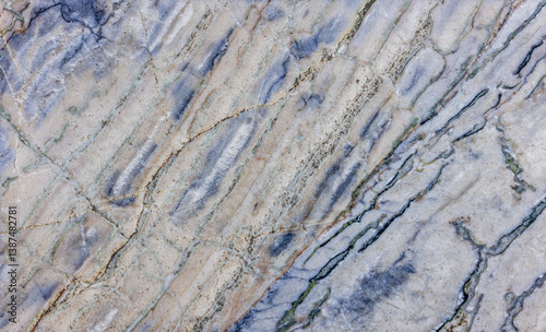 Close-Up of Worn Marble with Diagonal Blue and Tan Veins