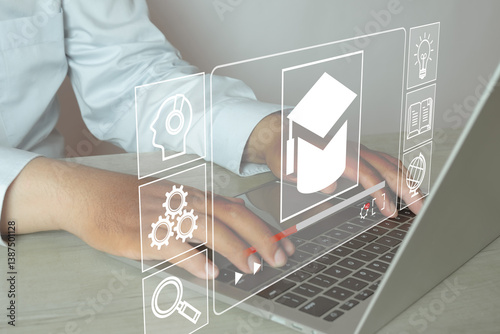 Digital learning and education concept with laptop showing icons for education, study, gears, and global knowledge. E-learning, virtual classroom, and technology in education.