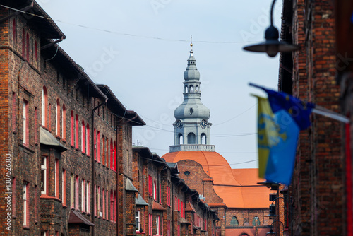 Obraz na płótnie Workers' housing estate. Church tower. Famous district of Katowice Nikiszowiec w salonie