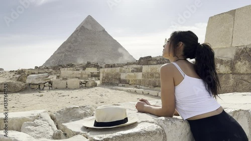 Join a tourist visiting the Great Pyramid of Giza in Egypt, a true wonder of the world. Explore the ancient marvels of the Giza Plateau and witness history.