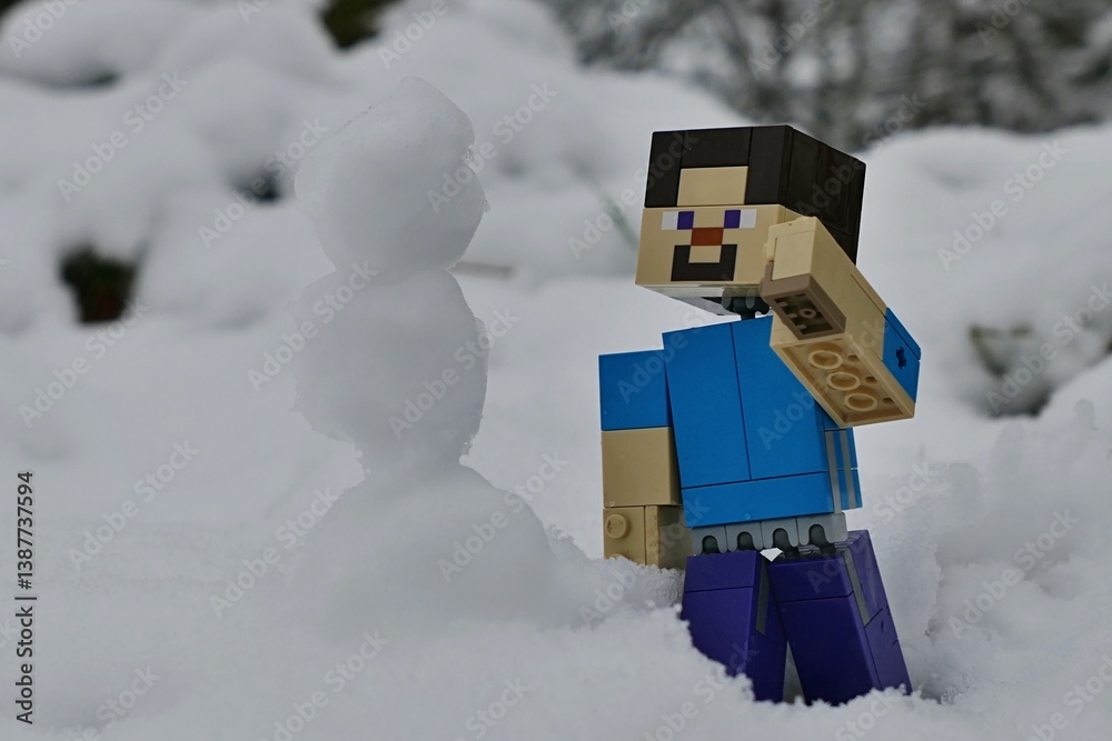 Obraz premium LEGO Minecraft large figure of Steve just build a slim snowman in snow covered forest. 