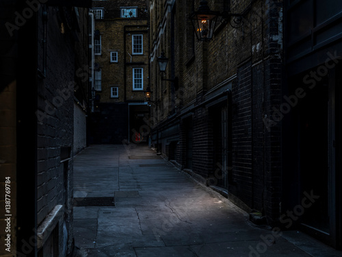 A mysterious, grimy and hidden old back alley in London at night