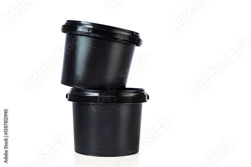 Two black plastic buckets made of polypropylene (PP) with snap-on lids, stacked on top of each other, used for storing bulk materials or industrial products.